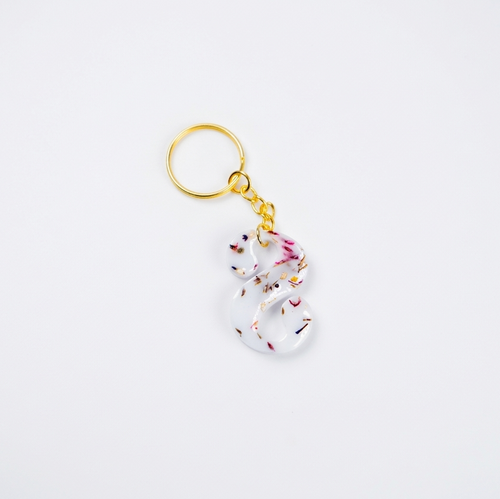 Keychain with floral design on a white background
