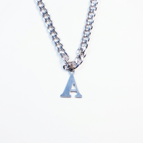 Silver necklace with a small letter 'A' pendant on a white background