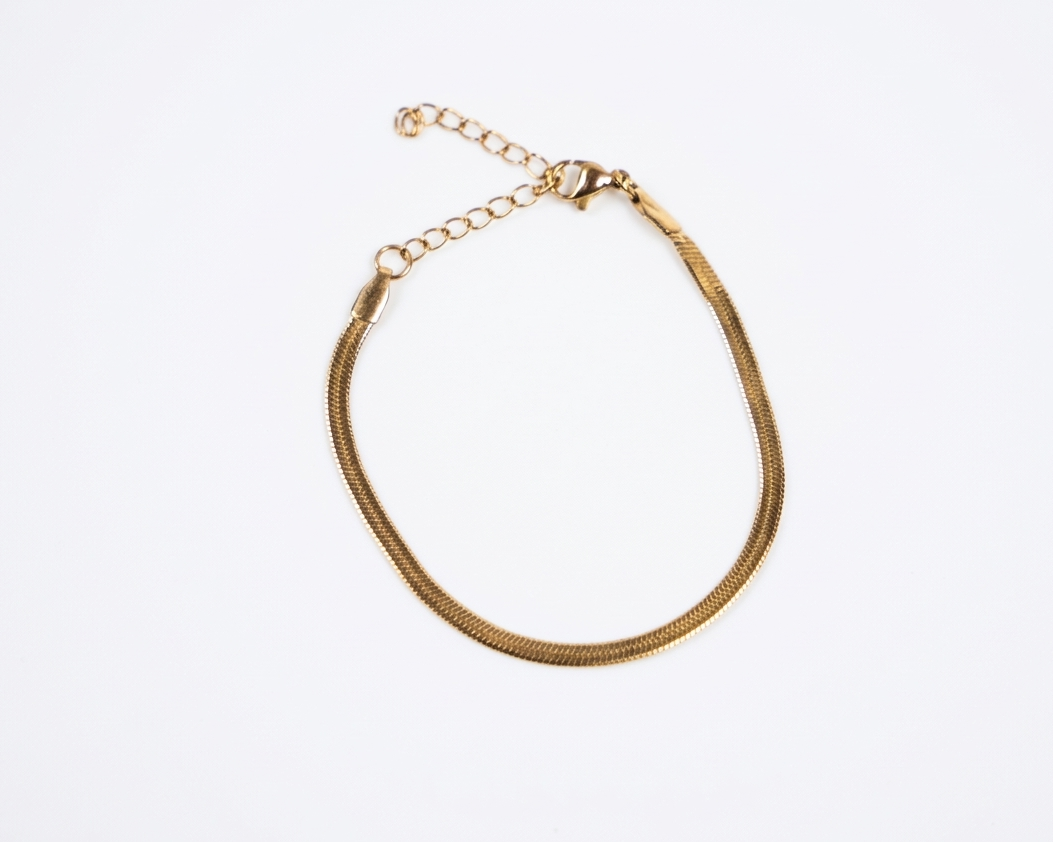 Gold bracelet on a white background