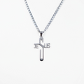 Silver cross pendant necklace with 'JESUS' on a white background