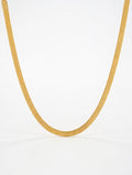 Gold chain necklace on a white background with 'Luxe Jewels' branding.